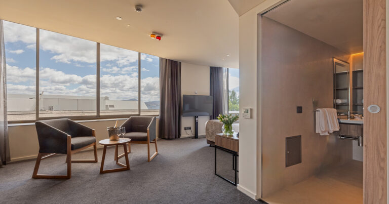 Deluxe Accessible King suite at Wrest Point showing lounge area and accessible bathroom entry