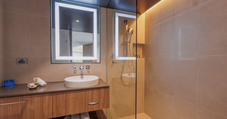 Mountain View Deluxe King bathroom at Wrest Point with backlit mirror and walk-in shower